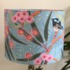 *light blue lampshade with bird and pink flowers