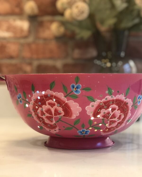 *bright pink colander with flowers