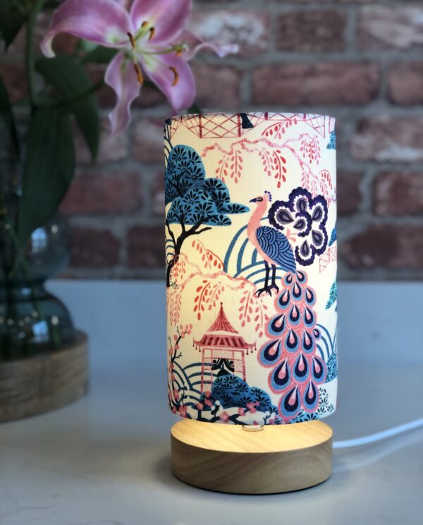 *pink and blue chinoiserie peacock and pagoda lamp with wooden base