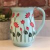 *pale mint green enamelware jug with lotus flower