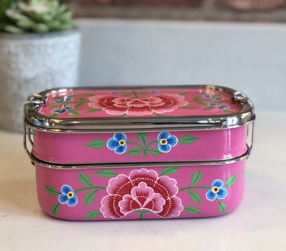 *bright pink metal lunchbox with flowers